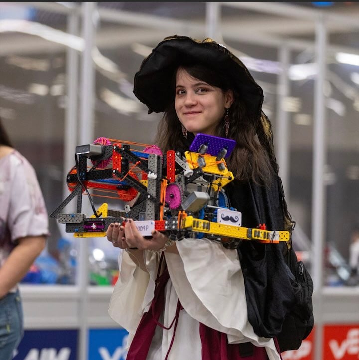 Participant carries her robot at VEX Robotics World Championship